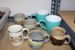 lot 59 image: Mug Collection Includes Frito Lay Mugs, 2 Glazed Pottery Mugs and 2 Blue-Green Ceramic Mugs