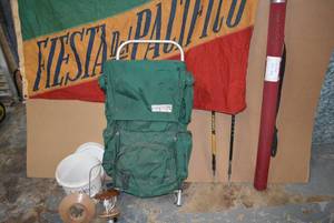lot 133 image: Hiking Lot Wilderness Experience Backpack, Two Galyans Walking Sticks (Adjustable Height), Fly Rod CASE ONLY, Flag, Glass Lantern (needs Propane Tank)
