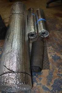 lot 143 image: Reflective Barrier - One large 4 ft. Roll, 2 smaller roils (Probably cut for Windshield Blockers Plus Piece of Floor Map Material