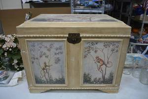 lot 156 image: Wooden Trunk with Monkey Designs with Felt Lined Interior (Parts need re-glued)  25.5 Wide x 20 Tall