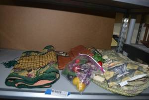 lot 169 image: Kitchen Linens with Grapevine Design (Placemats, and Table Runner) and Fruity Napkin Holders