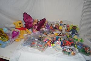 lot 178 image: LARGE Assortment of Toys Including Plush Care bear, Barney and Winnie the Pooh
