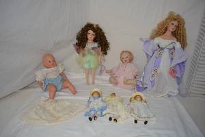 lot 181 image: Porcelain Doll Collection - Beautiful Details, Please Preview Some with Tags Plus One Plastic Baby doll