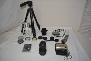 lot 14 image: Olympus Camera and Bag, Lens, Lens Cap Holder, Lens Filters, and Manfrotto Tripod
