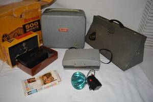 lot 13 image: Vintage Cameras and Projector Flashbulbs, Polaroid 210, Kodak Movie Camera Model 2, Brownie 500 Movie Projector 8mm, Bulb Case