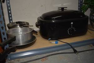 lot 63 image: Large Electric Roasting Pan by GE Model 169152 and Misc. Pans