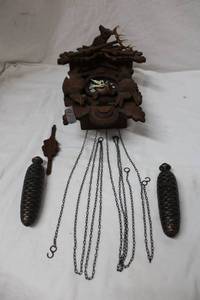lot 58 image: Coo -Coo Clock (One of the Wooden Leaves is Cracked)