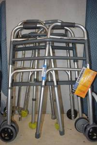 lot 35 image: 3 Folding Walkers and 1 4-Prong Based Cane Walker