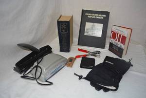 lot 236 image: Misc. Lot Books - Cook County History�, Armageddon Oil and Terror, ..Dictionary, Alarm Clock Radio, Leather Hole Punch, Fossil Wallet and More