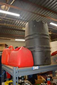 lot 274 image: Two Plastic Gas Cans and Water Barrel