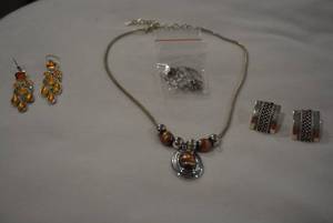 lot 335 image: Signed jewelry selection. Includes an 18L with earrings, chandelier earrings (Both marked LC) and a pair of Bosc poststud earrings (Marked Bosc)