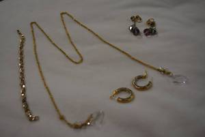 lot 338 image: Bling jewelry selection. Includes Toledo Spain - Style gold and silver finish crystal poststud hoop earrings, a pair of Aurora Borealis crystal dangle clip earrings, a crystal bracelet 8L and a Lariat style 32L necklace with cut glass crystal end caps.
