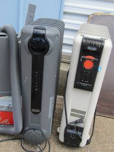 lot 74 image: Two Delonghi electric heaters (one gray one white)