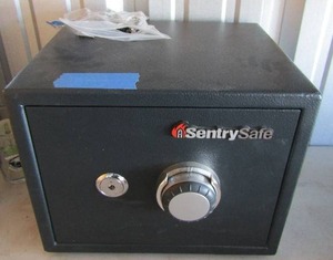lot 89 image: Sentry safe with key unknown code Cannot open