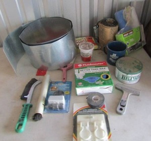 lot 93 image: Misc. lot-  Briwax fluidmaster toilet seal NEW 2 piece mom broom holder NEW  touch pad plus more