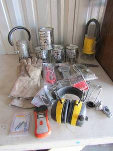 lot 95 image: 4 opened containers of unlabeled NEW set of battery cable terminals, 50 lbs. digital scale NEW welding gloves 2 hand held lights