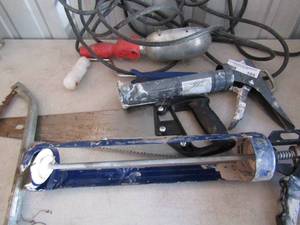 lot 105 image: Large & small caulking guns, 2 hand saws and hanging workshop light