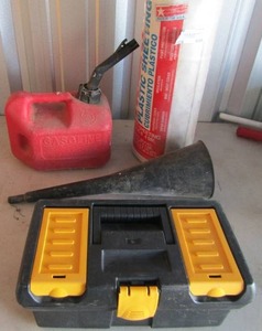 lot 106 image: Large funnel, 1 gal. gas can, NEW roll of husky plastic sheeting plus black and yellow tool box