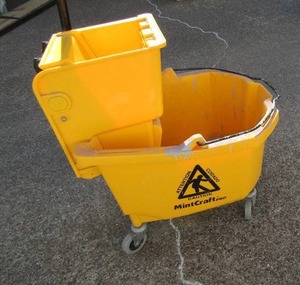 lot 116 image: Yellow rolling industrial mop bucket