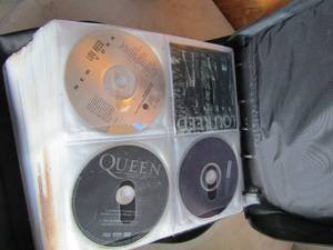 lot 126 image: Over 100 CDs (Rock and country) in black carry case
