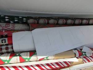 lot 25 image: Tub full of wrapping paper some used