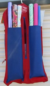 lot 35 image: Homemade hanger that holds wrapping paper, bags, tape and name tags