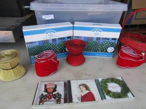 lot 41 image: Holiday ribbon red and gold  2 boxes 150 blue net lights Red wicker basket 3 holiday music CDs
