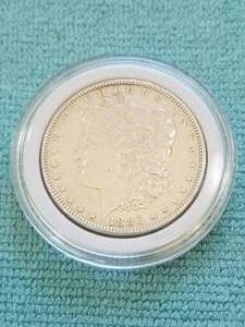 lot 1 image: Morgan Silver Dollar in capsule storage case - 1883