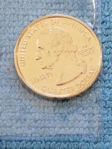 lot 123 image: 2001 24 KT gold plated uncirculated statehood quarter
