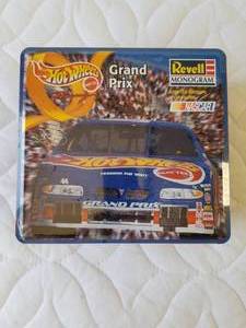 lot 157 image: Revell Monogram Hot Wheels Grand Prix - Nascar racing model kit in metal tin - unopened