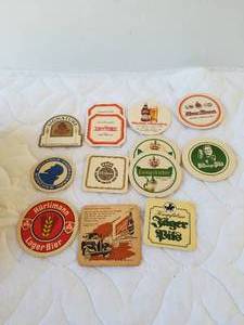 lot 223 image: Selection of Beer coaster and a Charles Cookies tin