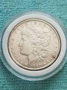 lot 330 image: Morgan Silver Dollar in capsule storage case - 1889