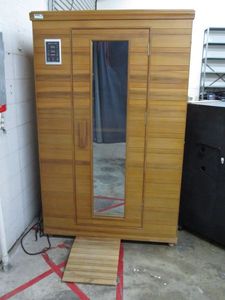 lot 1 image: HEALTH MATE 2 PERSON INDOOR INFARED SAUNA W BUILT IN BLUETOOTH, AMFM RADIO, CD PLAYER, UP TO 170 DEGREES FAHRENHEIT, CONTROL PANEL ON OUTSIDE &amp INSIDE, VERY EASY ASSEMBLY