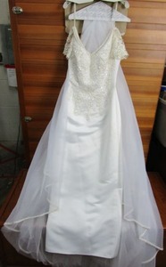 lot 9 image: VINTAGE SATIN WEDDING DRESS WITH BEAUTIFUL LACE APPLIQUE.HAS DETACHABLE ORGANZA TRAIN WITH LACE APPLIQUE,&nbsp BY LADY ELEANOR