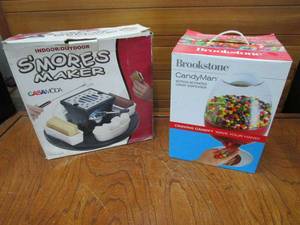 lot 33 image: INDOOROUTDOOR SMORES MAKER IN BOX, BROOKSTONE CANDYMAN MOTION-ACTIVATED CANDY DISPENSER IN BOX