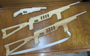 lot 37 image: RUBBERBAND GUNS, 1 RESEMBLES DOUBLE BARREL SAWED OFF SHOTGUN, 2 AR STYLE RIFLES
