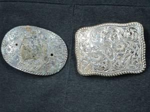 lot 46 image: 2 BELT BUCKLES, 1 HAS NO MARKINGS AND SOME DISCOLATION, OTHER ONE IS VINTAGE EL ARTURO BRONZE CRUMINE FROM CRUMINE INC. JEWELER &amp SILVERSMITH
