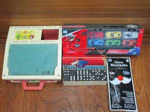 lot 88 image: VINTAGE FISHER PRICE SCHOOL DAYS DESK WITH COMPLETE ALPHABET MAGNETS, VINTAGE 28 PIECES MAGNA DOMINOES FROM THE EMBOSSING CO., TOY CONTAINER TRUCK CONTAINING 6 CARS NEW UNOPENED, GLOW MUSTACHE
