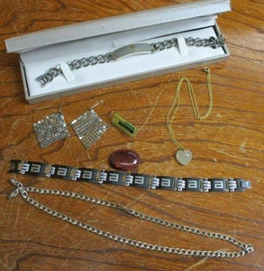 lot 94 image: JEWELRY LOT, VINTAGE SATIN GLASS HEART PENDANT W GENUINE SWAROVSKI CRYSTAL ON GOLD COLOR CHAIN, SILVER NECKLACE STAMPED 925 ITALY, (2) STAINLESS STEEL BRACELETS ONE HAS THE LORDS PRAYER OTHER IS BRAND BEING, SILVER COLOR EARRINGS, VINTAGE MICROSOFT