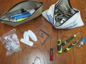 lot 104 image: (2) BANK CASH BAGS WITH COMPUTER TOOLS AND MISC. HOOKS, SCREWS AND MORE. CAUTION SOME ITEMS ARE SHARP, DO NOT USE YOUR HAND TO DIG THROUGH IT