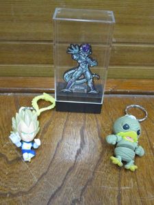 lot 105 image: HIGHLY COLLECTIBLE FIGPIN DRAGONBALL Z FRIEZA FINAL FORM IN CASE, DRAGONBALL Z BACKPACK HANGER, VINIMATES DONALD DISNEY KINGDOM HEARTS KEYCHAIN,