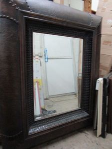 lot 146 image: LARGE MIRROR WITH LEATHER LIKE STUDDED TRIM