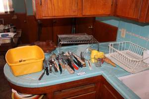lot 13 image: Kitchen Utensils and Dish Drying Rack, Pie Pans, Wooden Wall Phone Holder