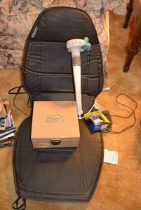 lot 103 image: HoMedics Heat Seat Cushion Massager, Panasonic Reach Easy Swing Massager, Pouch Arm Sling, Metal Cash Box