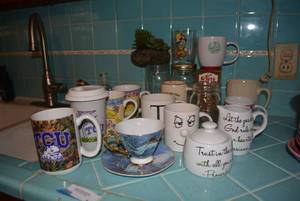 lot 11 image: Coffee Mugs (Including Ceramic TCU Mug with Lid and Sixth Kiln Tea Cup and Saucer) and Canning Jars