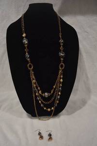 lot 206 image: Contemporary geometric swirl design station multi strand necklace and matching earring demi parure set. 16L