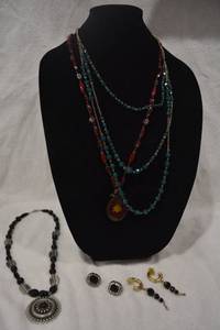 lot 208 image: Glass jewelry selection. Includes 3 glass bead necklaces and (2) pairs of glass earrings