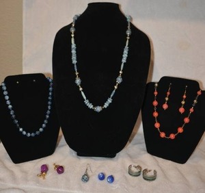 lot 203 image: Mid century contemporary marbled jewelry. Includes (2) demi parure necklace and earring sets, a marbled necklace and (2) sets of earrings. Also includes a pair of blue Moonglow Lucite Thermoset earrings.