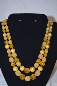lot 201 image: Mid century early butterscotch plastic bead necklace. Fish hook clasp. Marked GERMANY