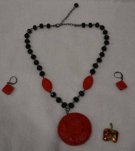 lot 200 image: Faceted glass bead necklace with faux cinnabar pendant, station beads and matching earrings. Also includes a cloisonn elephant pendant. Necklace 20L